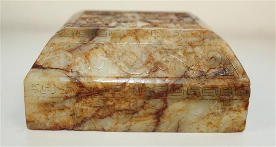 A Chinese archaistic stained and waxed bowenite jade scholars scroll weight, 11cm